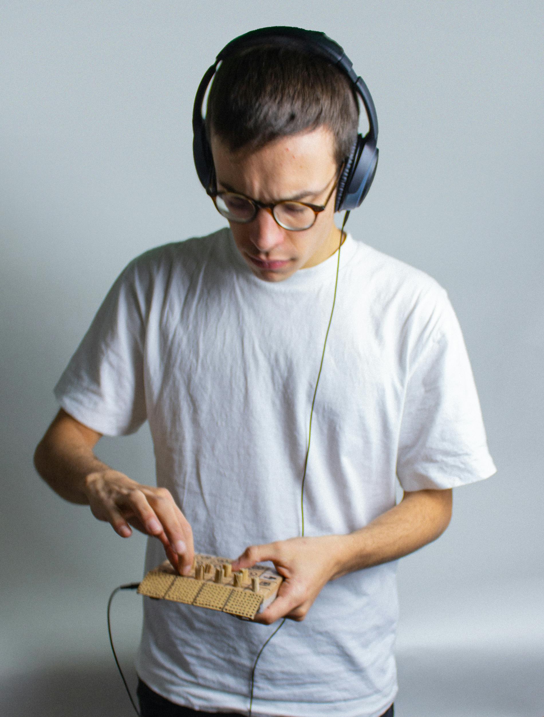 Standing man holding the sequencer