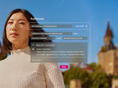 A young woman with straight dark hair and a neutral expression stands outdoors on a sunny day, wearing a cream-colored ribbed turtleneck. Behind her is a blurred backdrop of a European-style tower and green trees under a bright blue sky. Overlaid on the image is a user segmentation interface titled “Audiences,” showing a predictive attribute filter: users with a 0.7 to 0.9 probability of booking a hotel after purchasing a flight. The filter criteria include users in the U.S. who booked flights to Florida in the last 30 days but did not book lodging. The interface suggests a data-driven marketing approach for targeting potential hotel conversions.