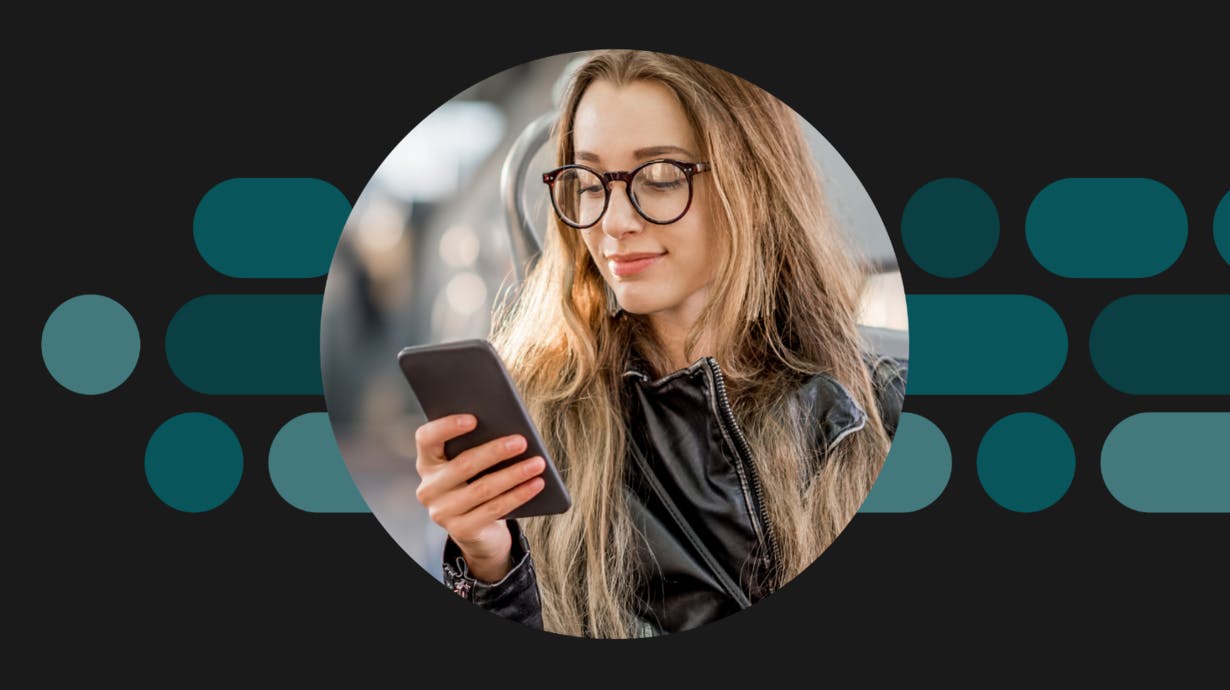 Woman looking down at her phone.