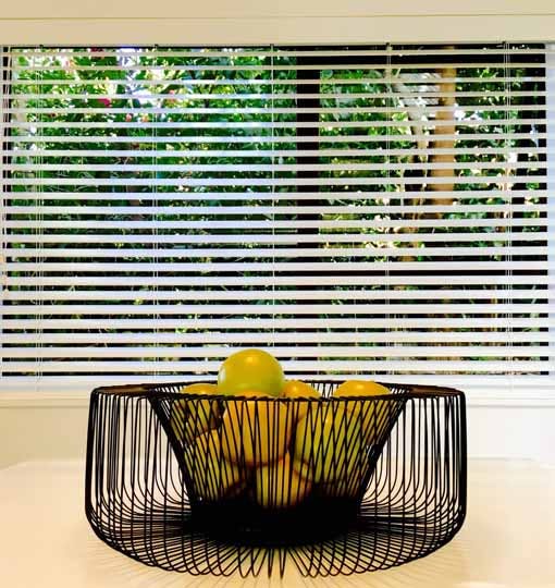 Enhance decor with white wood venetians nz