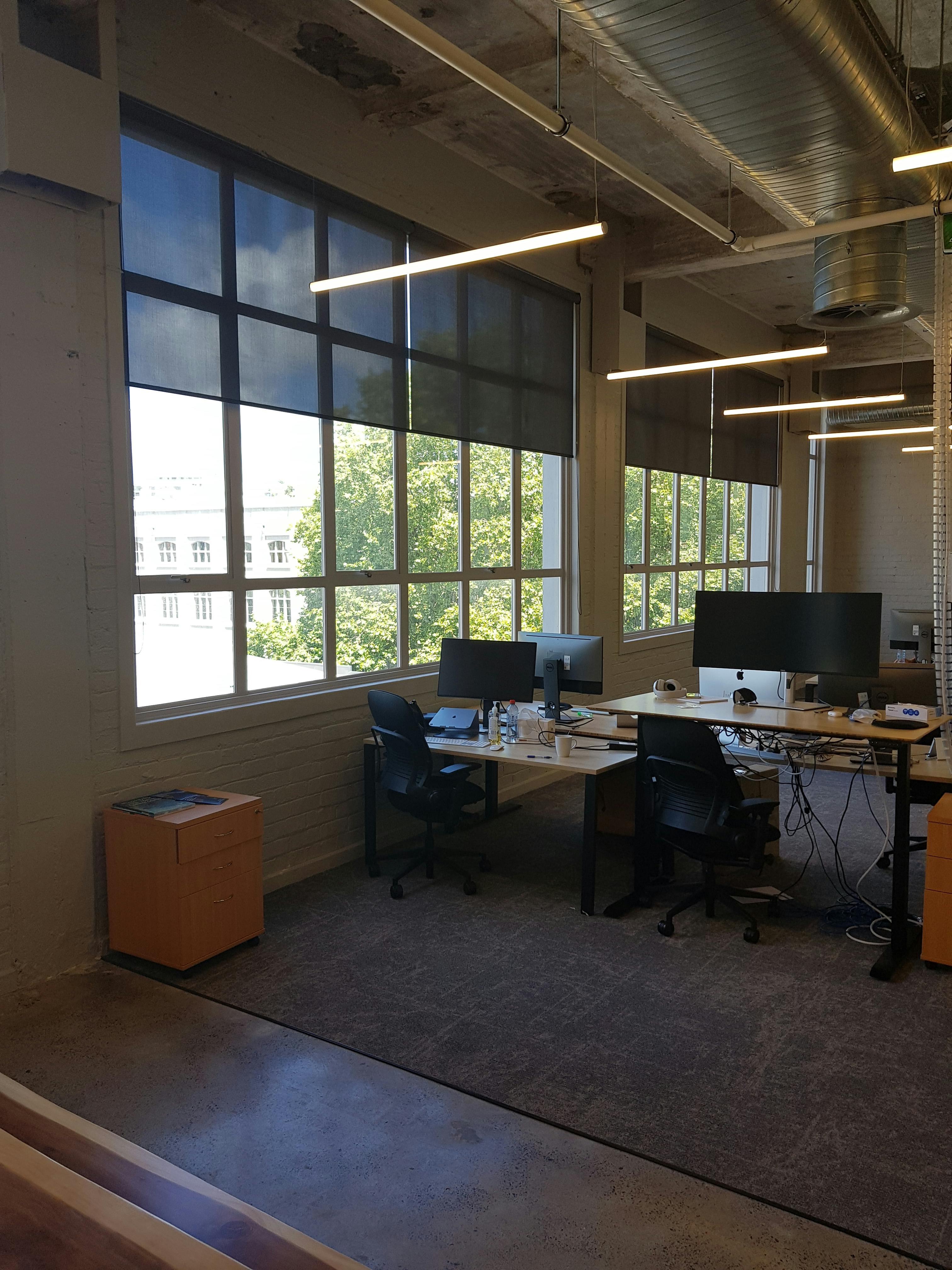 sunscreen roller blinds reduce glare in office nz