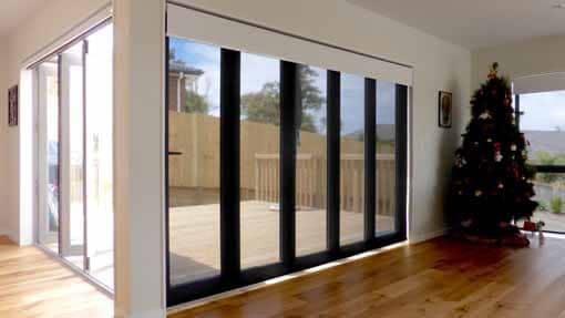 Dual blinds over stacked  bi fold doors nz