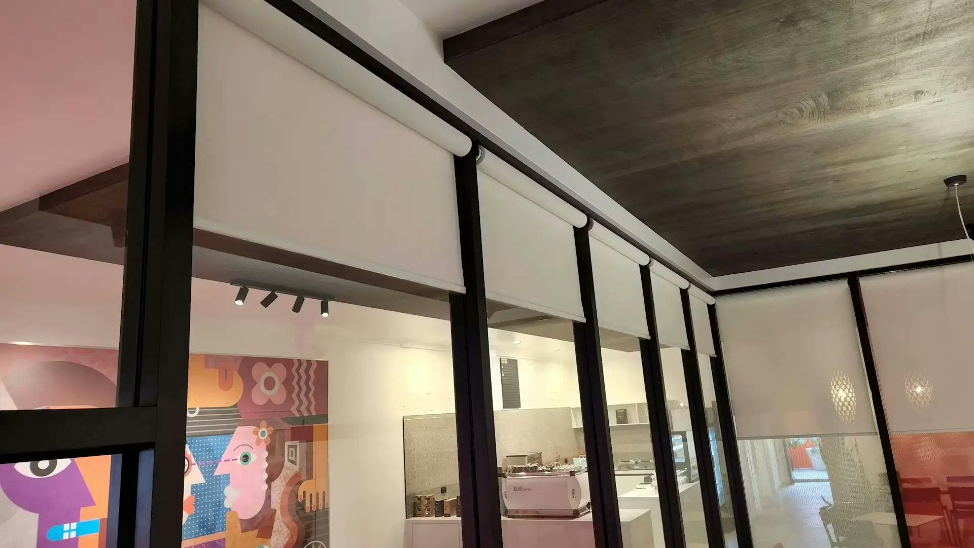 White roller blinds on cafe windows