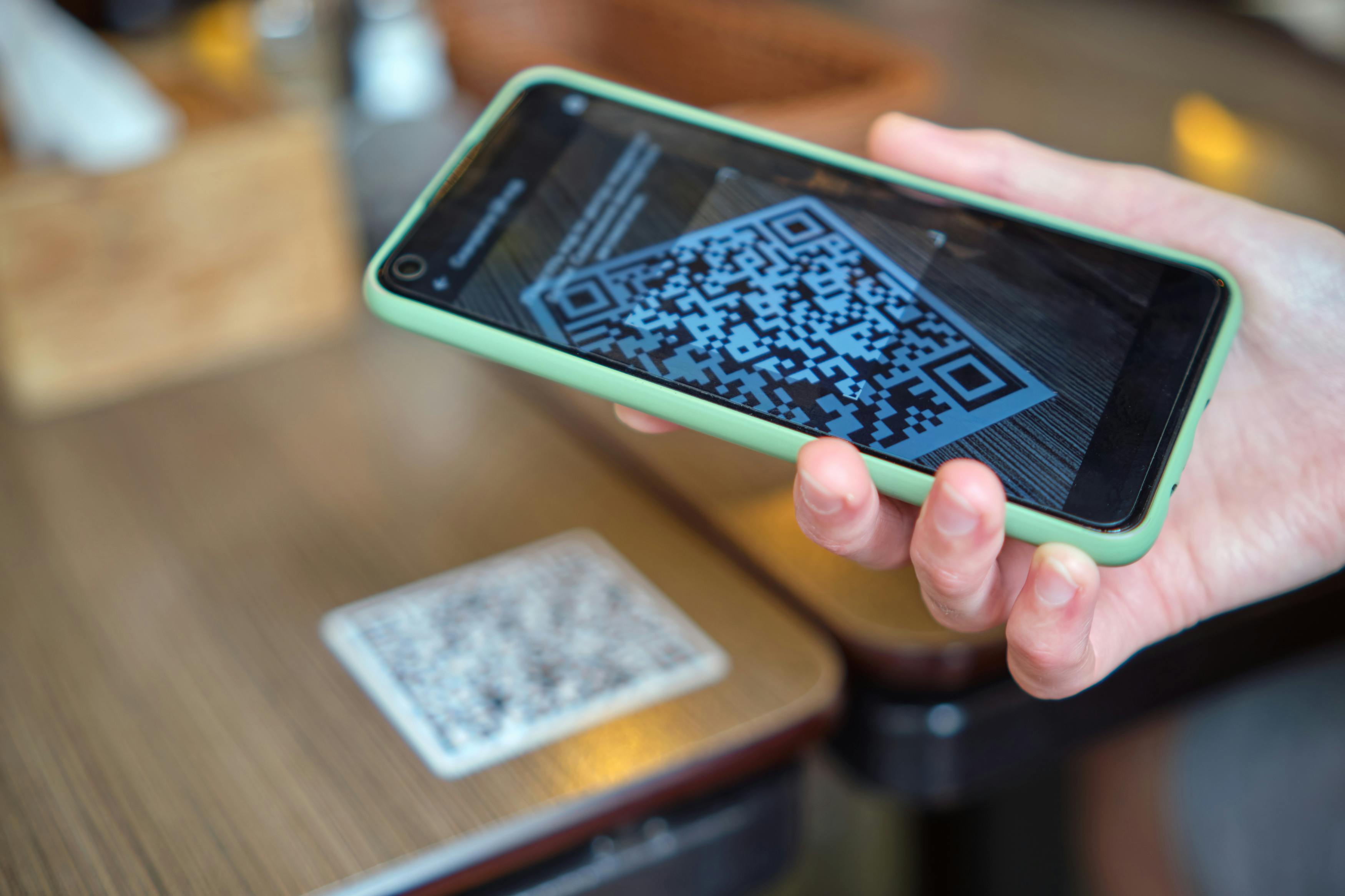 Closeup of someone scanning a QR code with a mobile phone