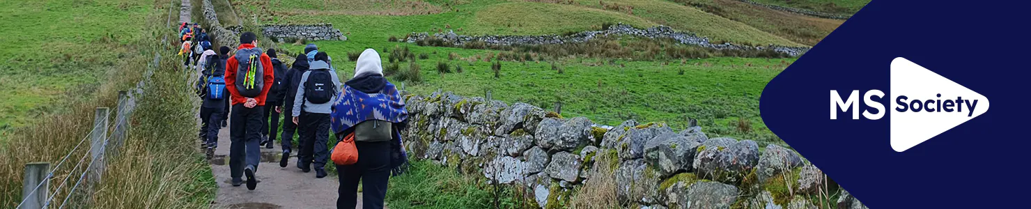 MS Society corporate hub banner with participants taking part in a charity walk in nature.