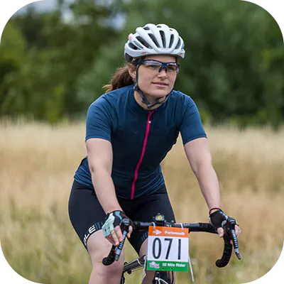 Cyclist with a charity race number on their bike. 