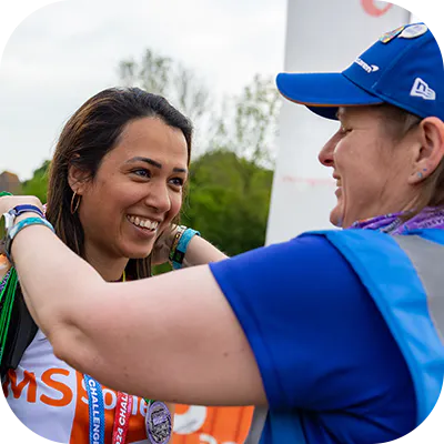 Two charity event participants smiling.