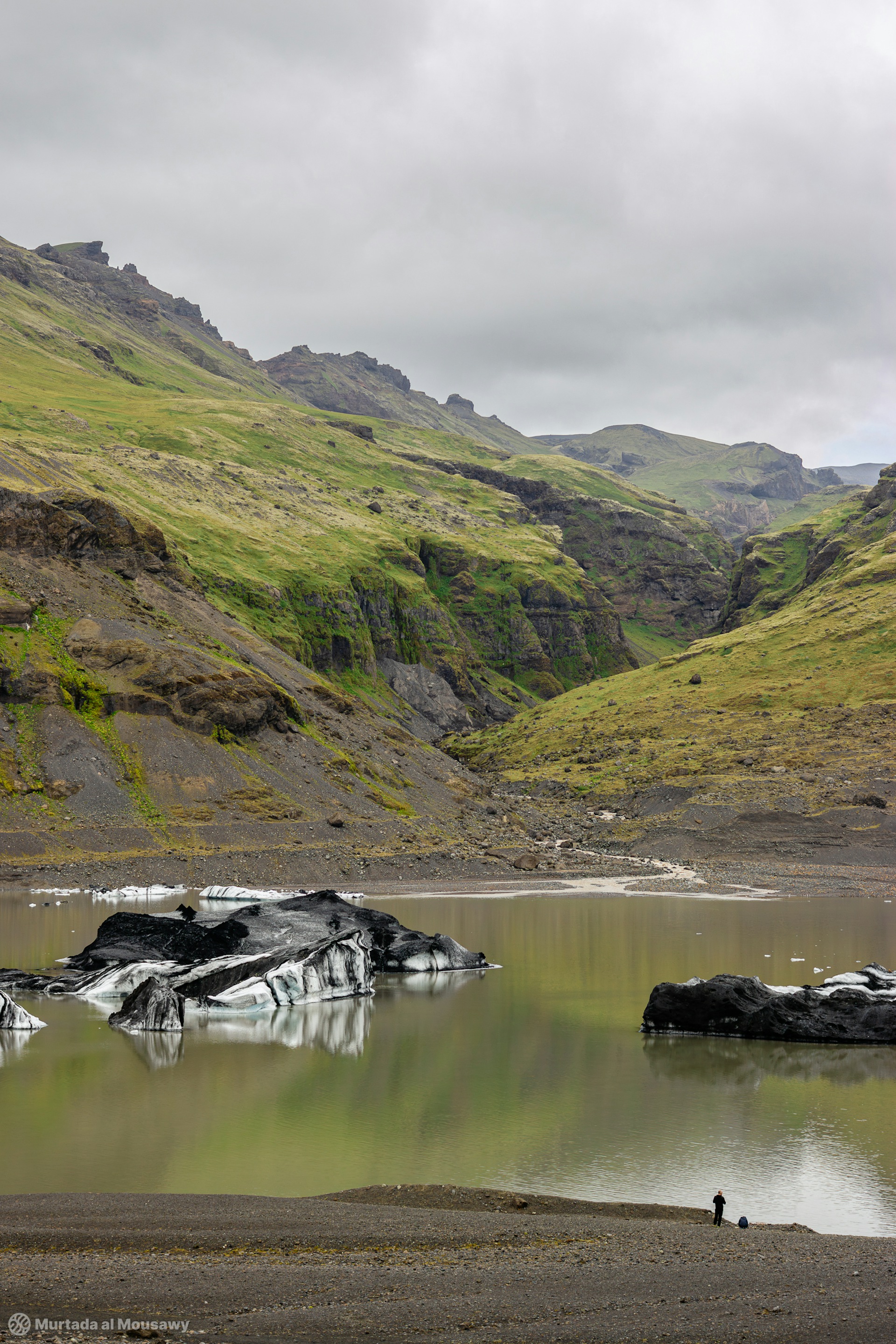 Typical Landscape of Iceland with a person bottom right showing the scale of the landscape