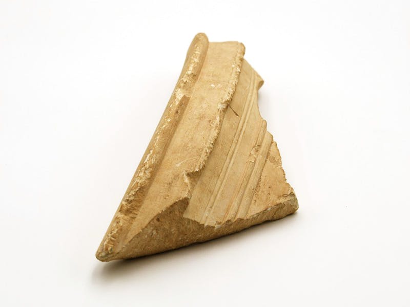 Fragment of a limestone jar, onto which the name "Yosef" is etched.