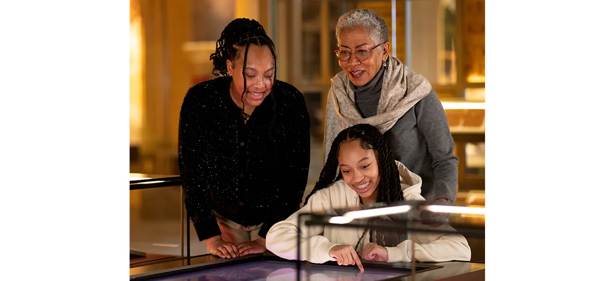 Multigenerational family engaging with exhibits on the History floor.