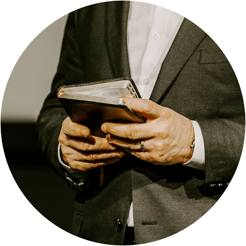 Man holding a Bible.