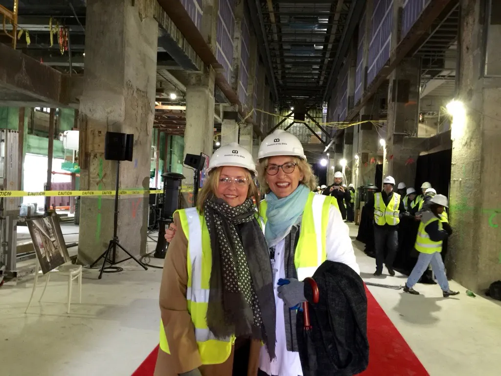 Jackie Green and Sherri Boyd in hard hats during the building of Museum of the Bible.