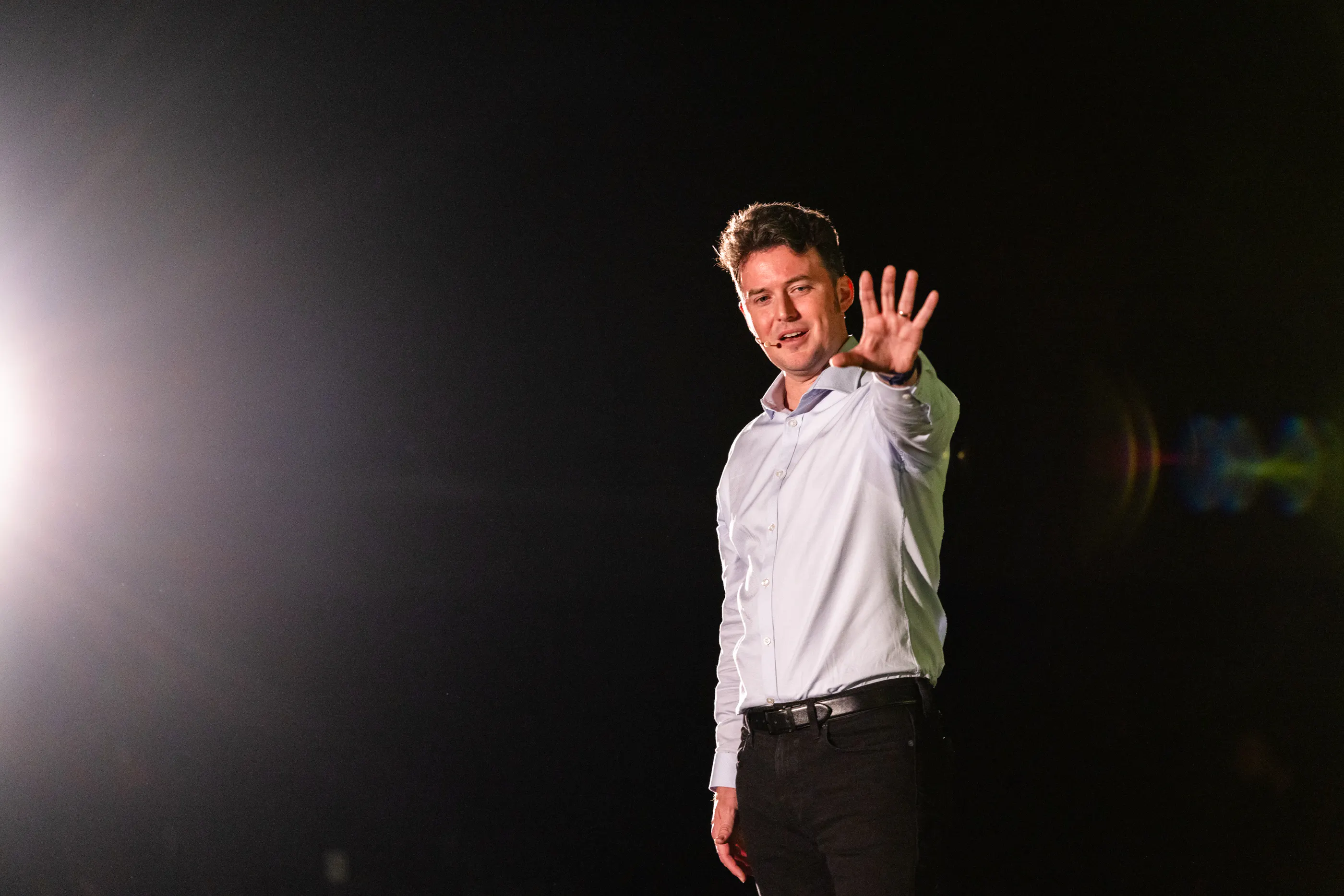 Stephen Trafton performing on stage.