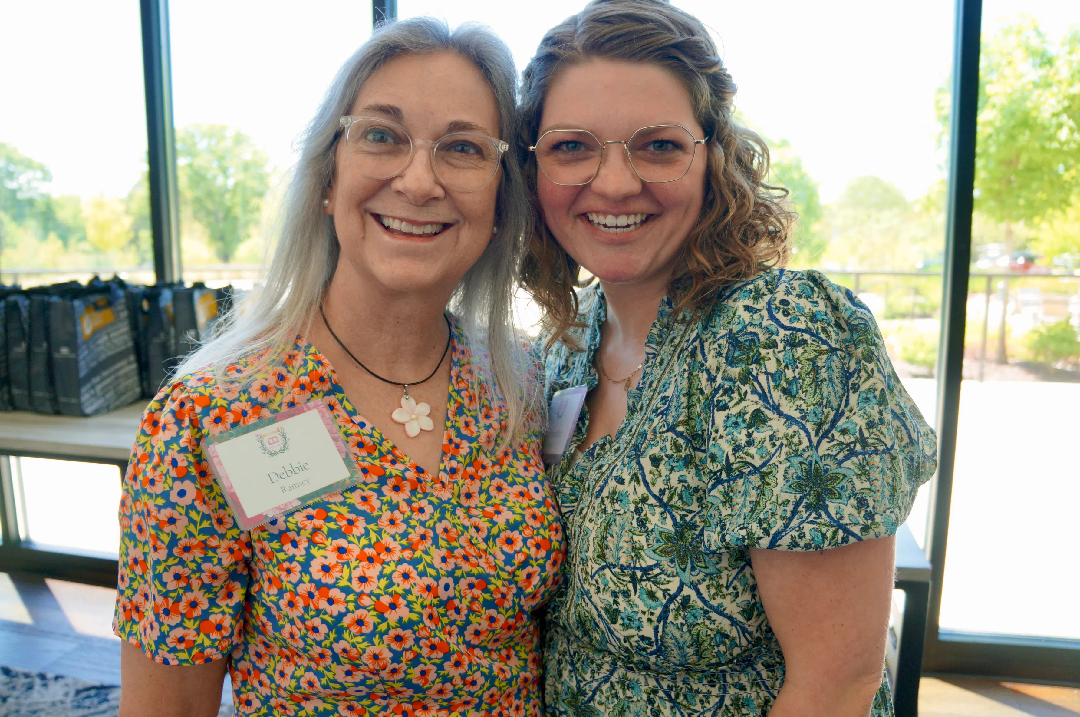 Deborah Ramsey and a museum of the bible guest taking a photo together