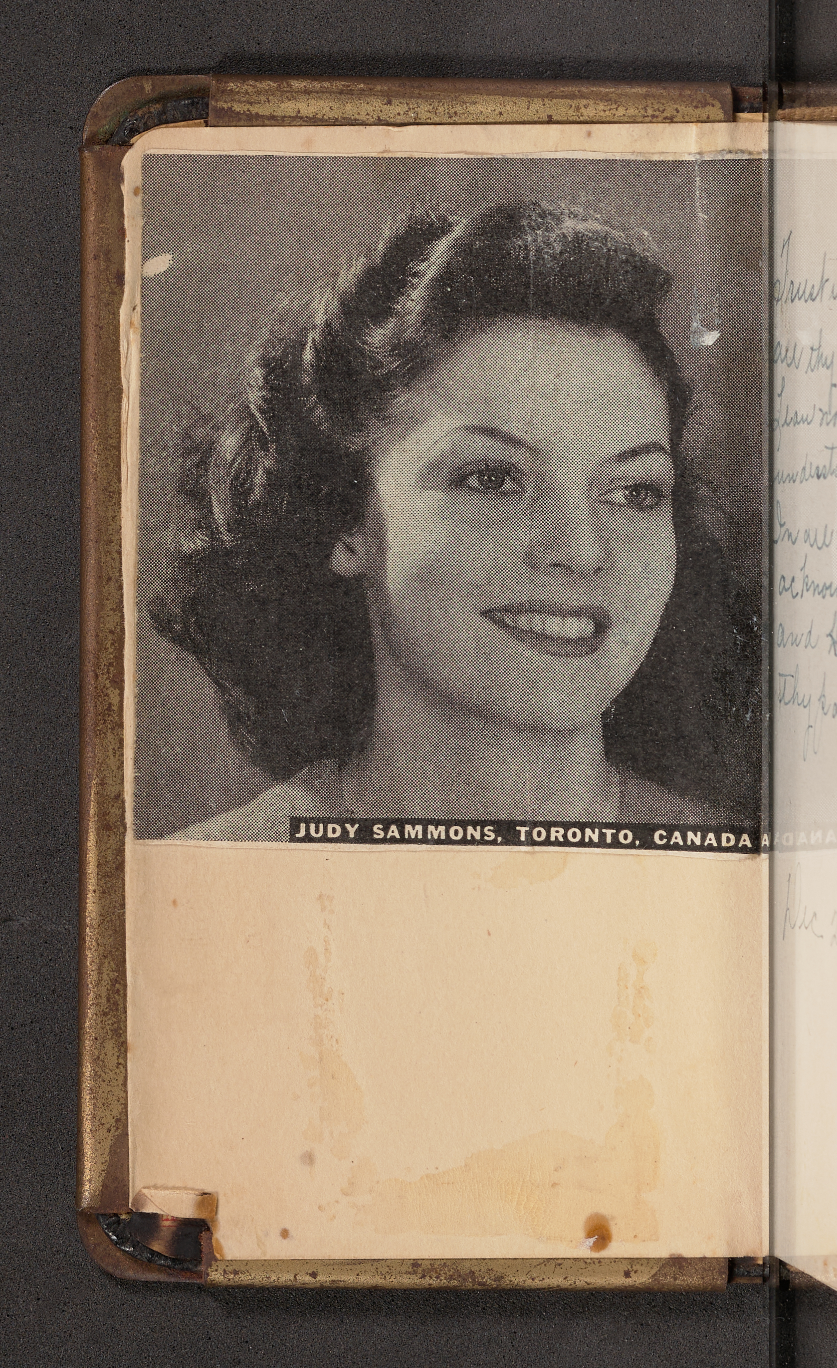 Photo of Judy Sammons, a Rockette, attached to the front cover of a Heart Shield Bible.