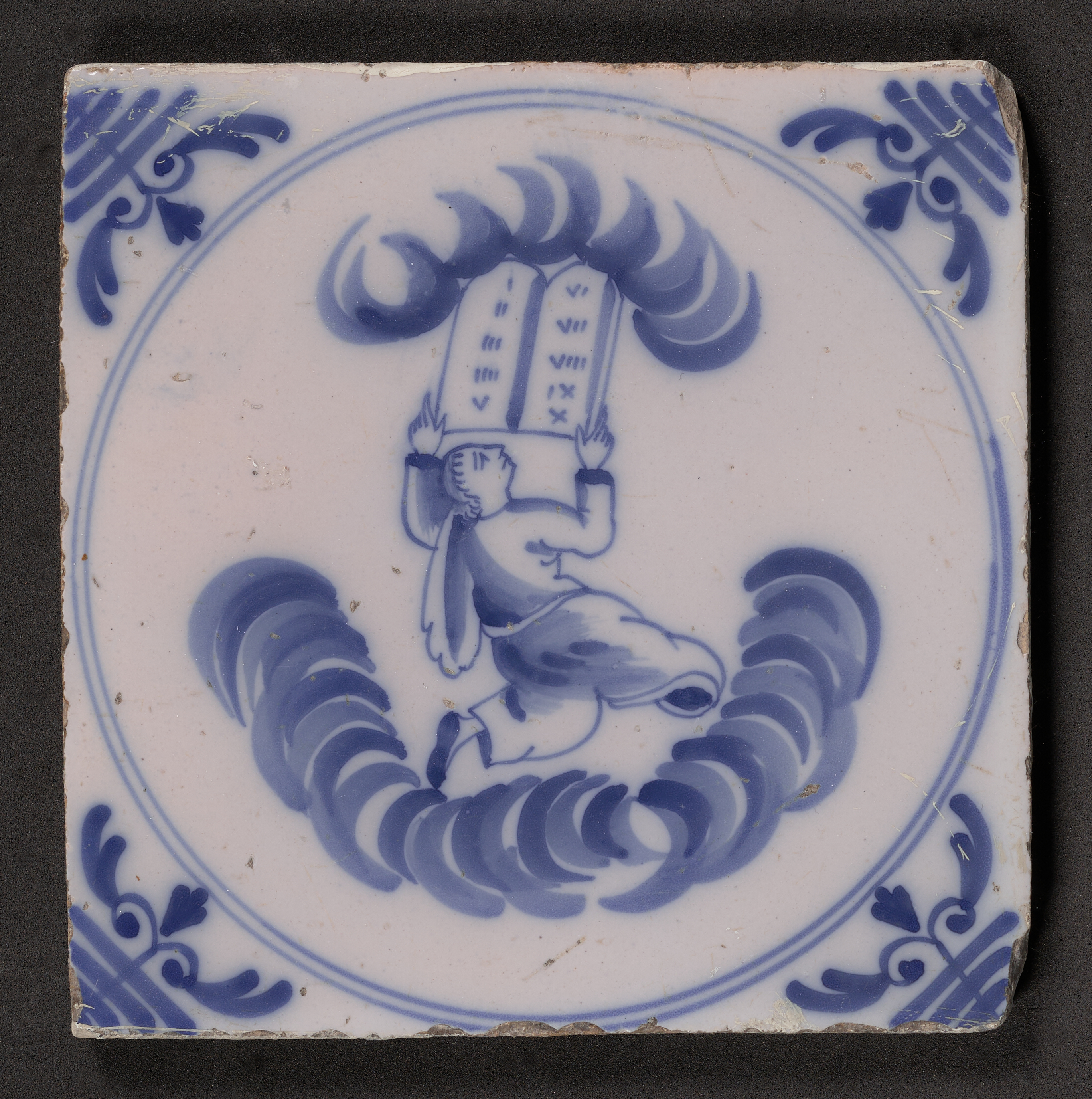 Moses Receives the Tablets of the Law depicted on a delftware tile