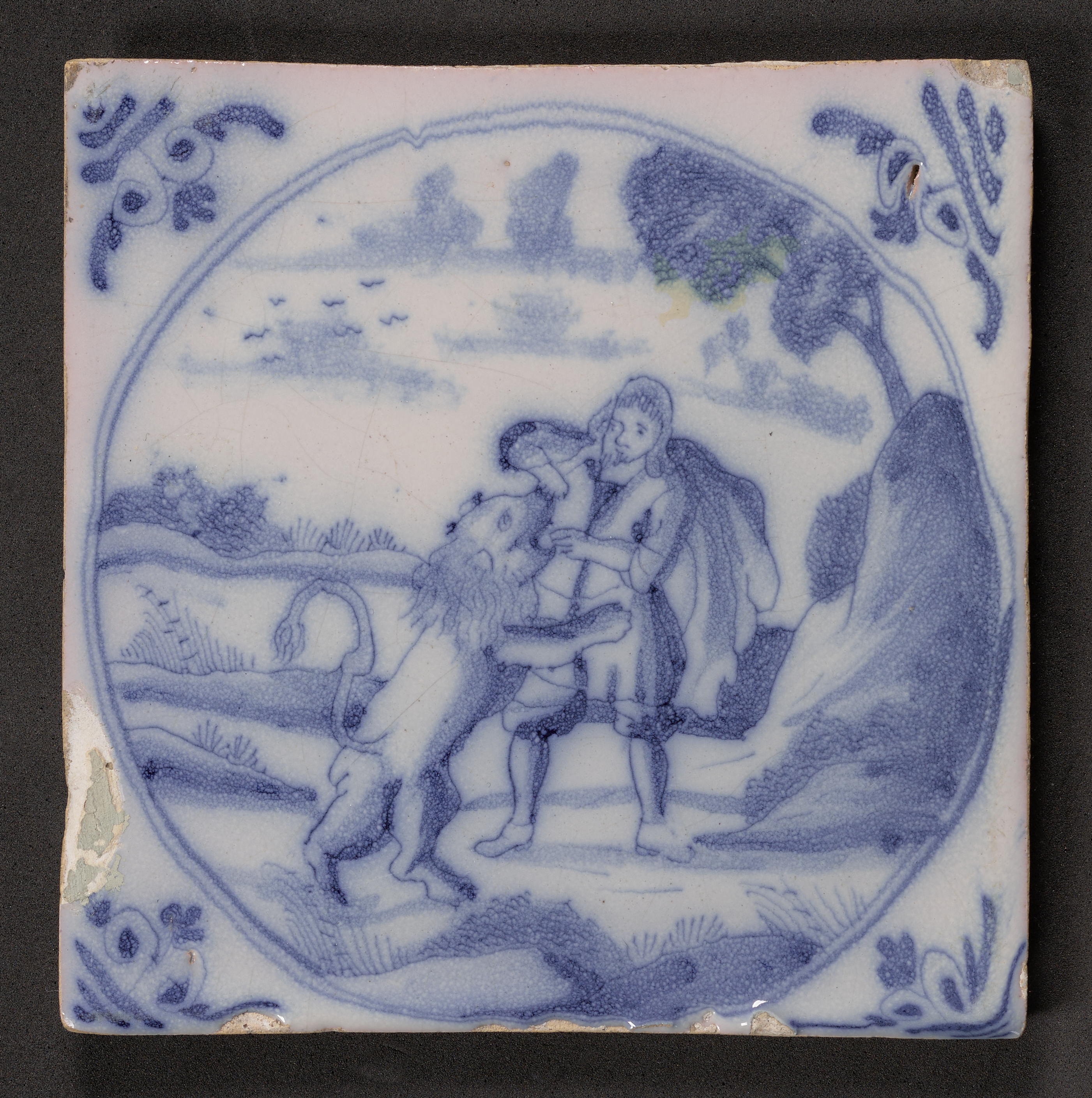 Samson and the Lion depicted on a delftware tile
