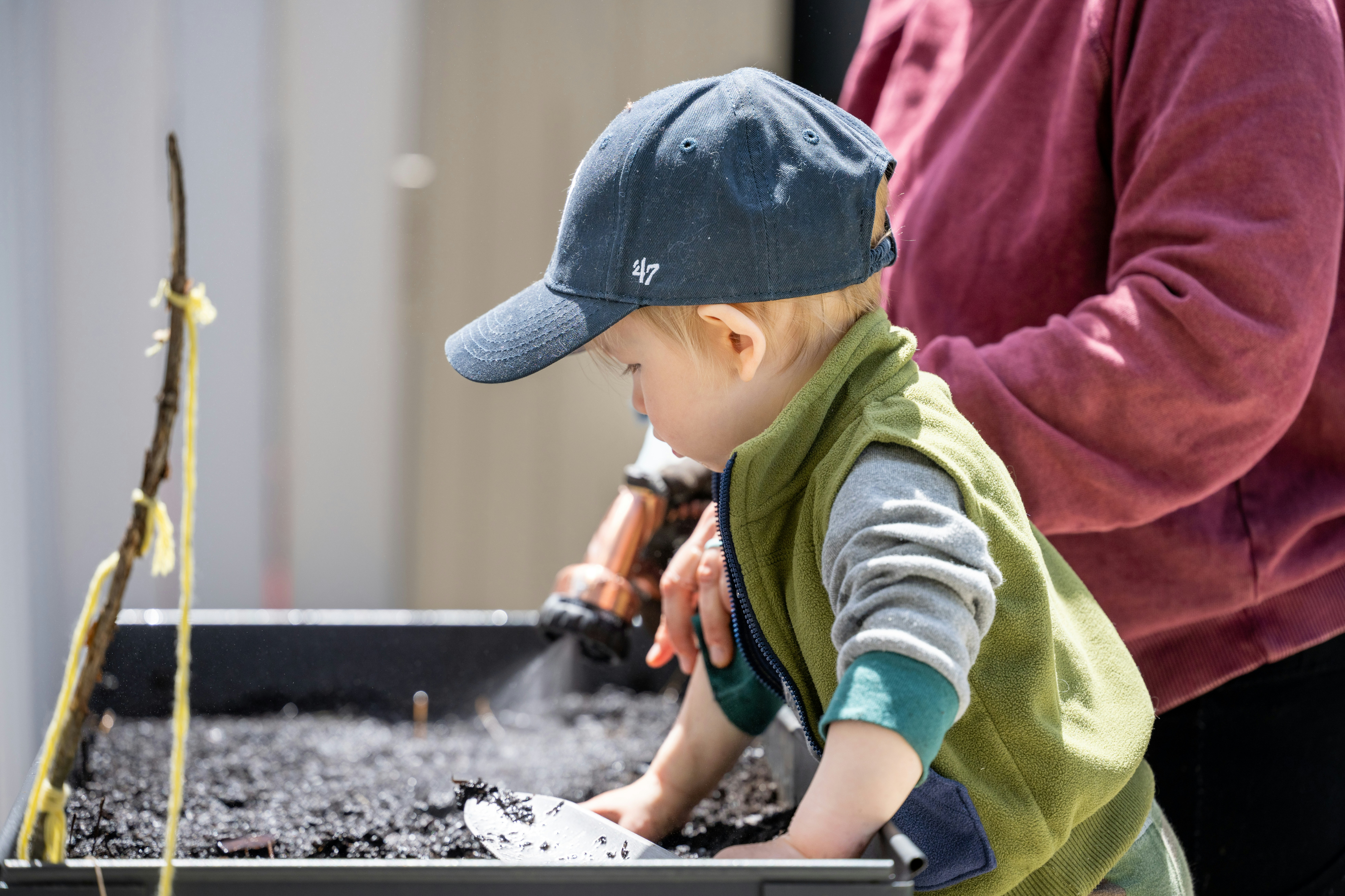 kid planting a plant