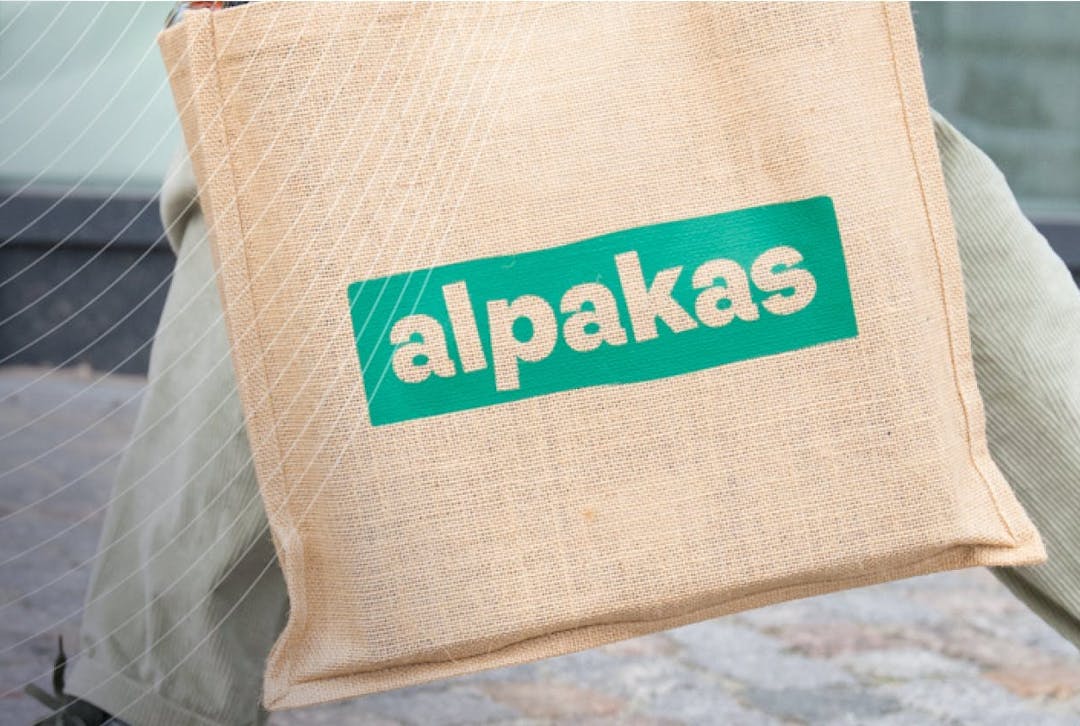 Person walking with an alpakas reusable shopping bag