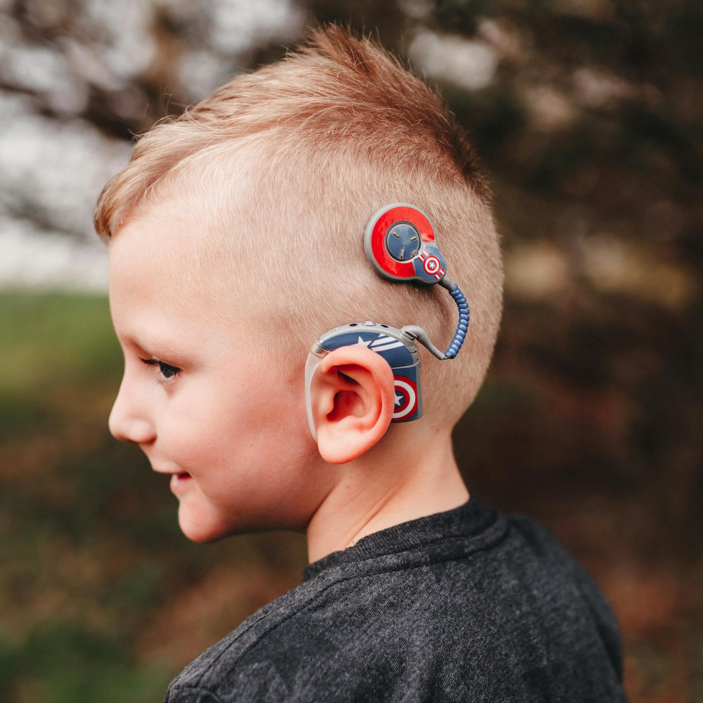 Boy wearing coclear implant
