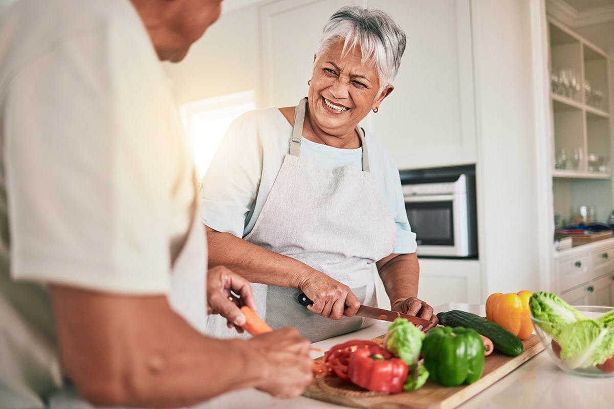 Husband and wife prepping food