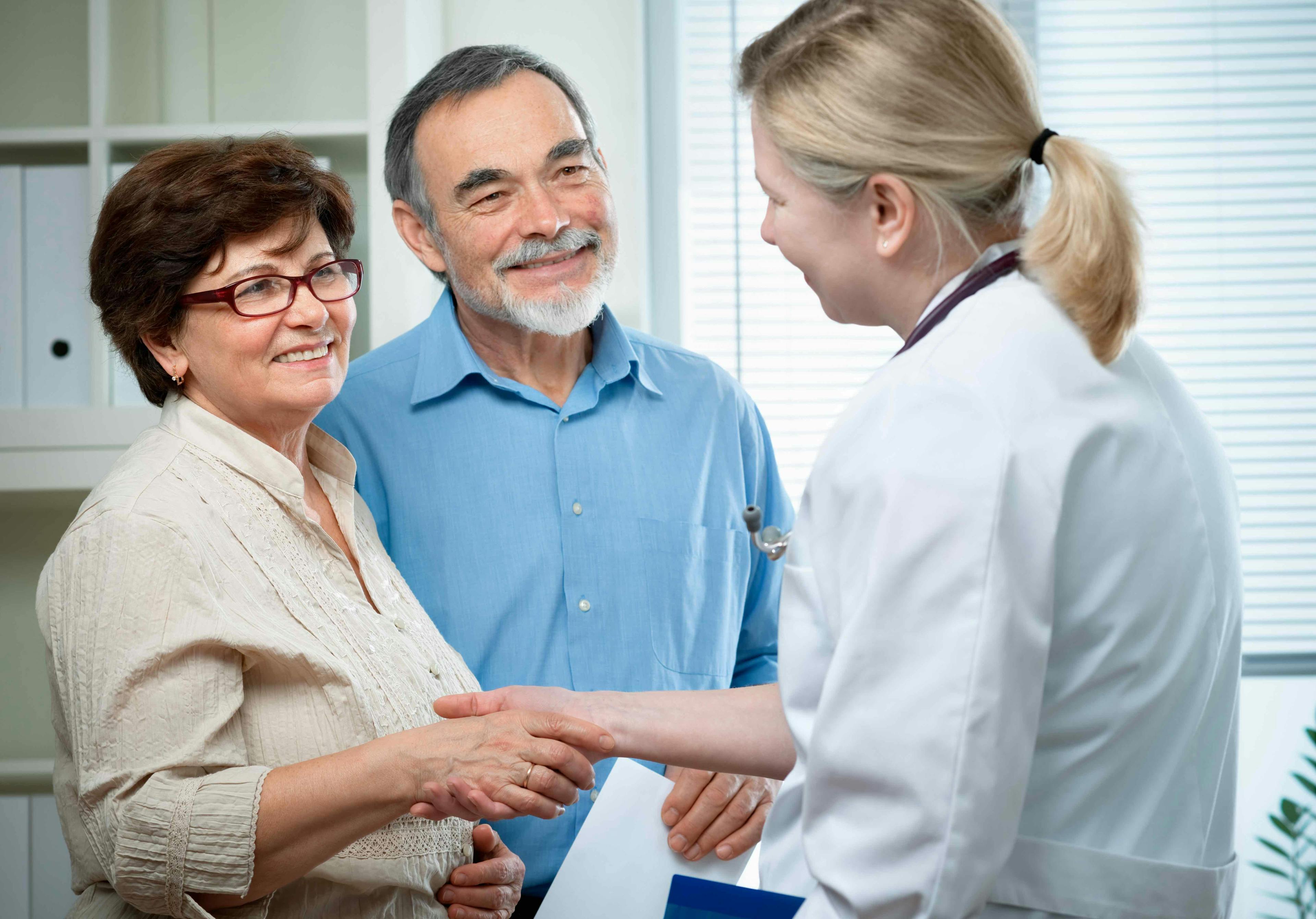 Older couple meeting with doctor