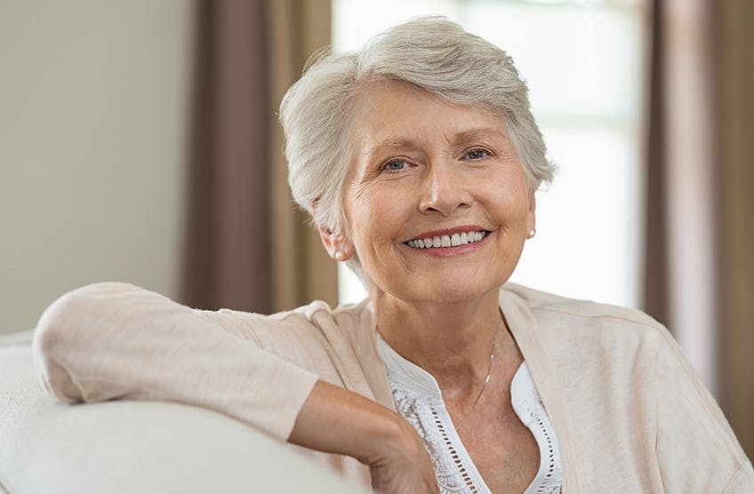 Smiling woman on couch