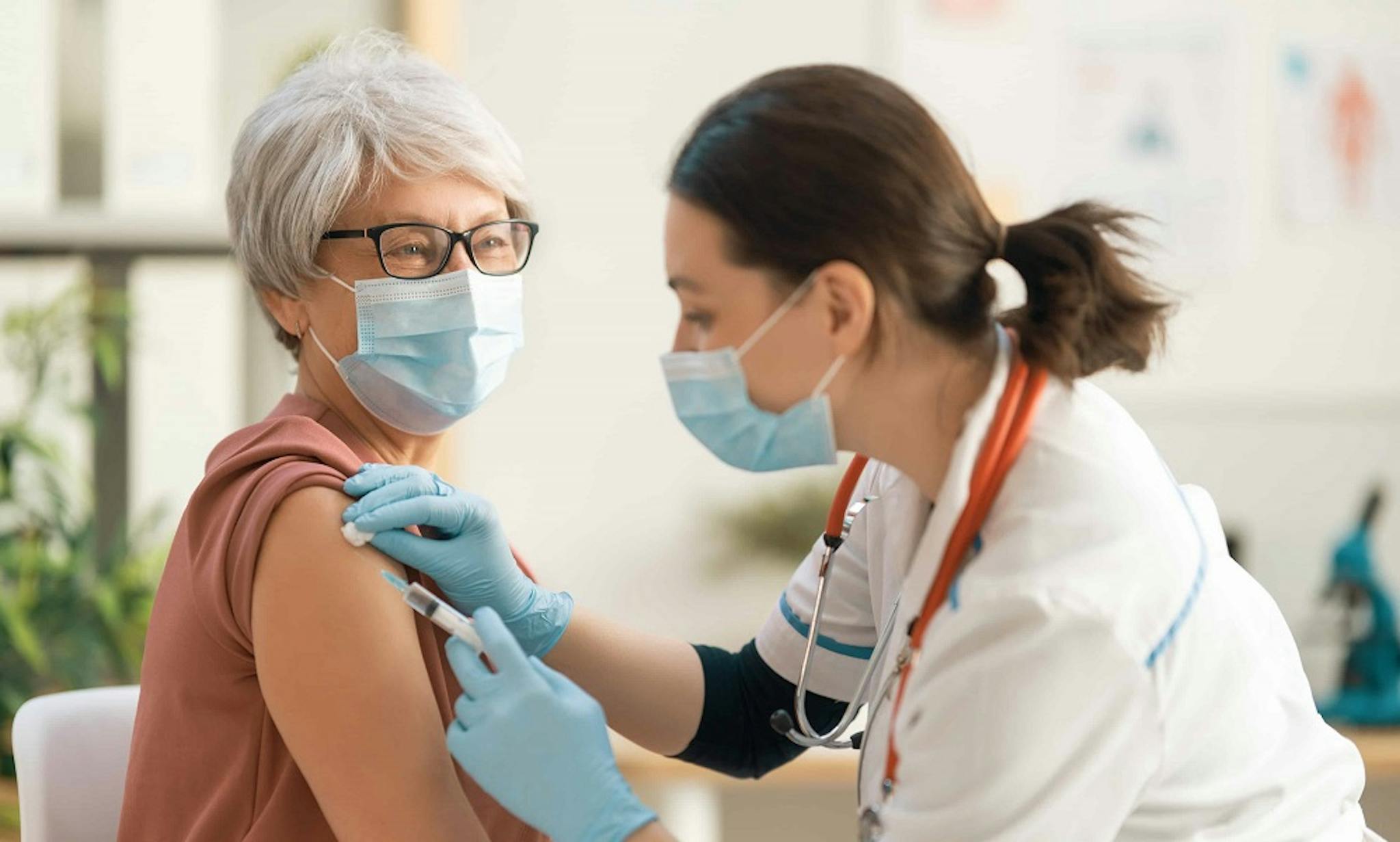 Doctor administering shot