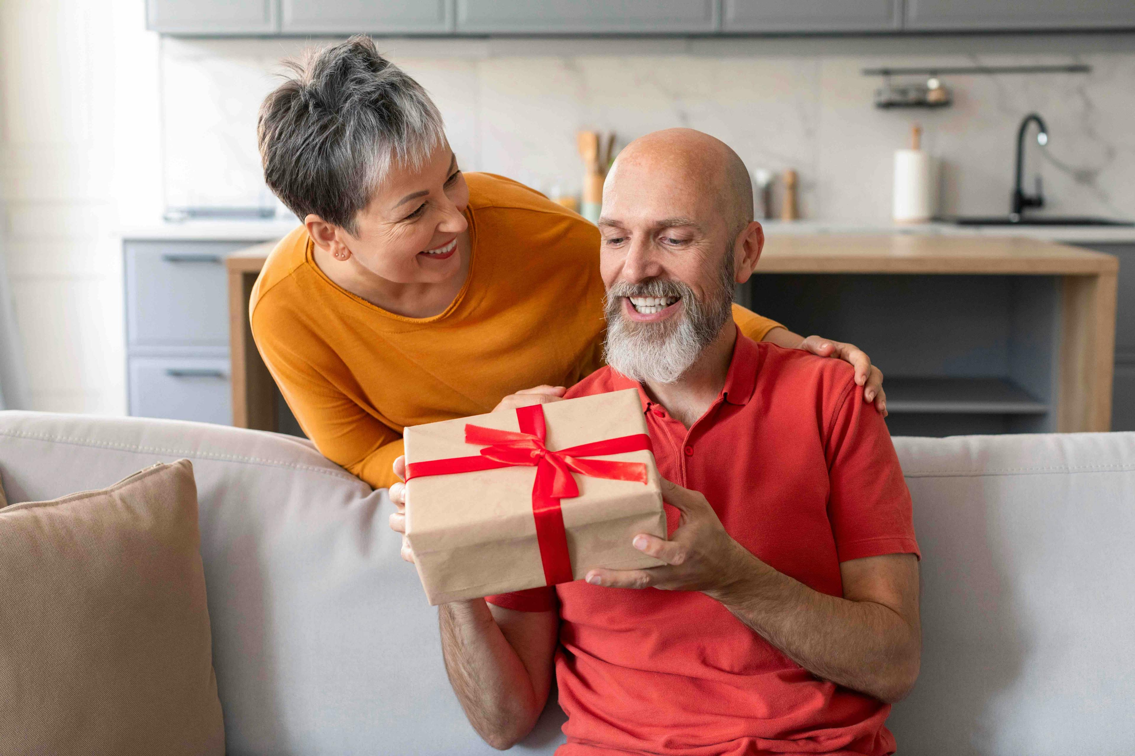 Man and woman exchanging gift