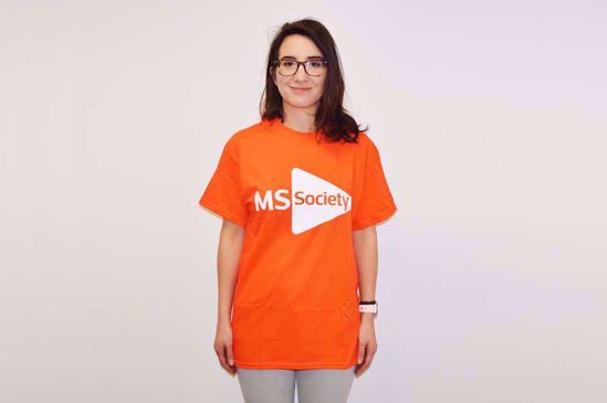 Person smiling in an MS Society t-shirt.