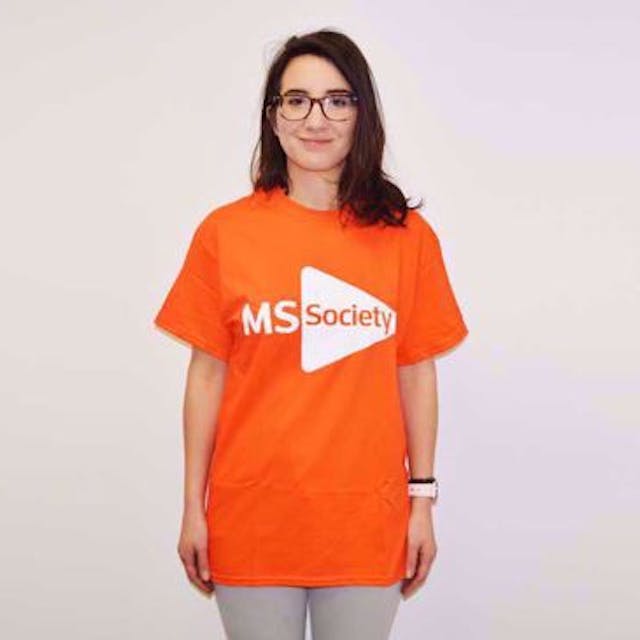 Person smiling in an MS Society t-shirt.