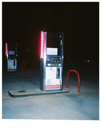 Gas pumps with neon lights on the sides