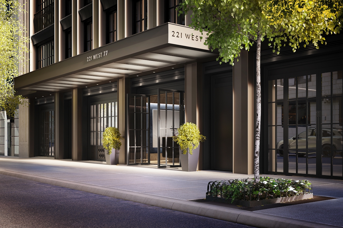 Exterior view of 221 West 77, a luxury residential building in New York City, featuring modern architectural design, large glass doors, and lush greenery, creating a sophisticated and welcoming entrance on a quiet street.