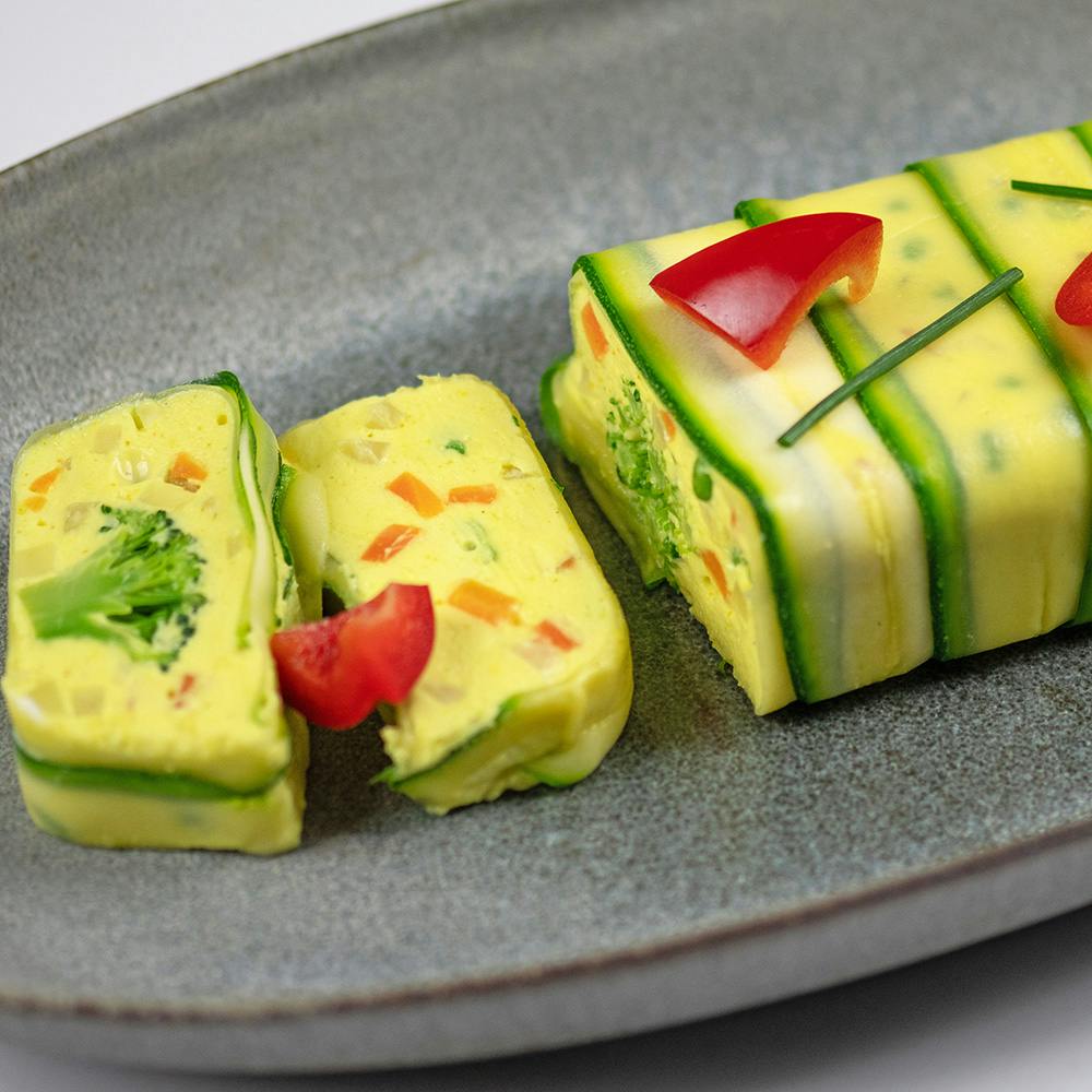 Recette de terrine de légumes au curry en manteau de courgette