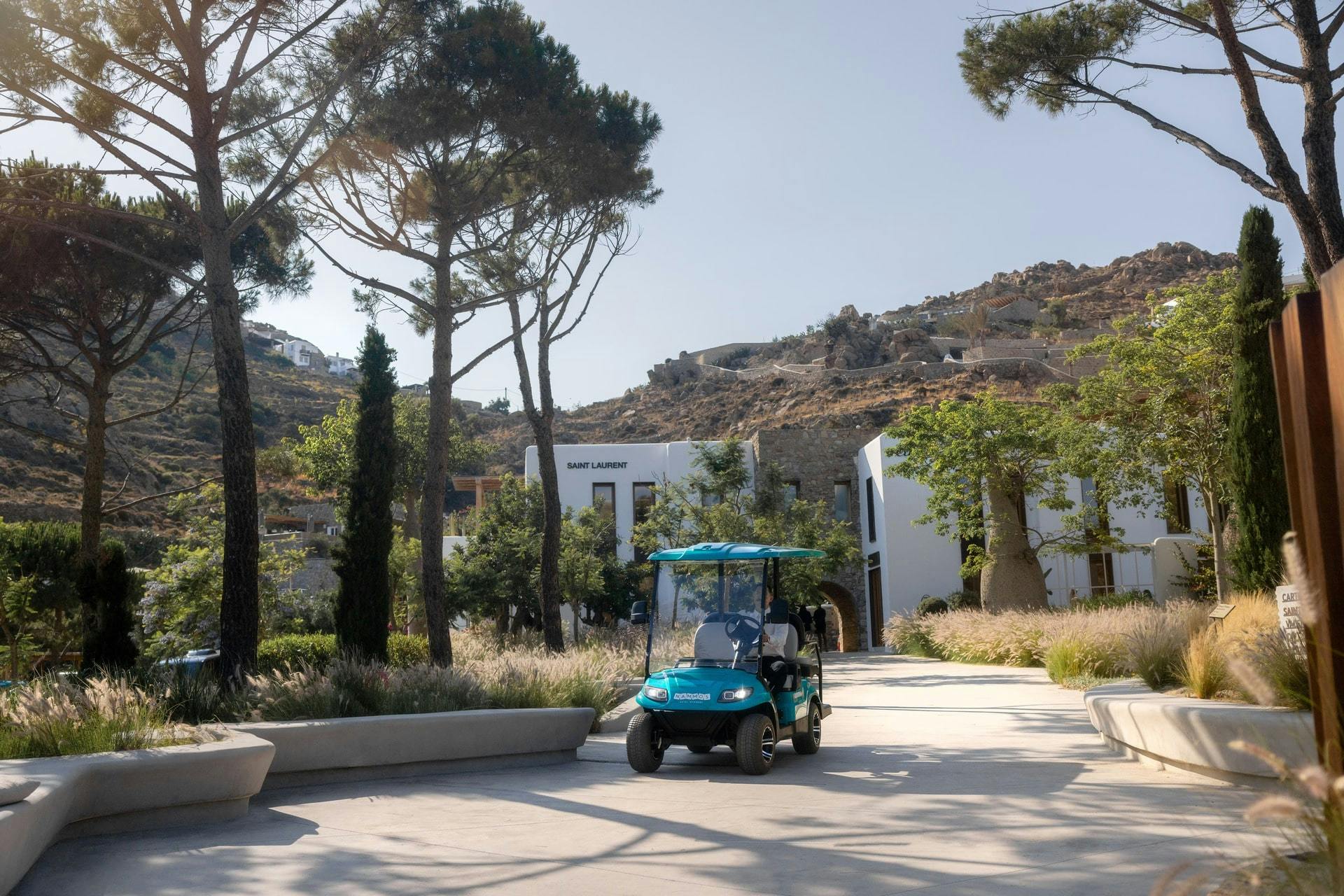 Buggy driving through Nammos Village