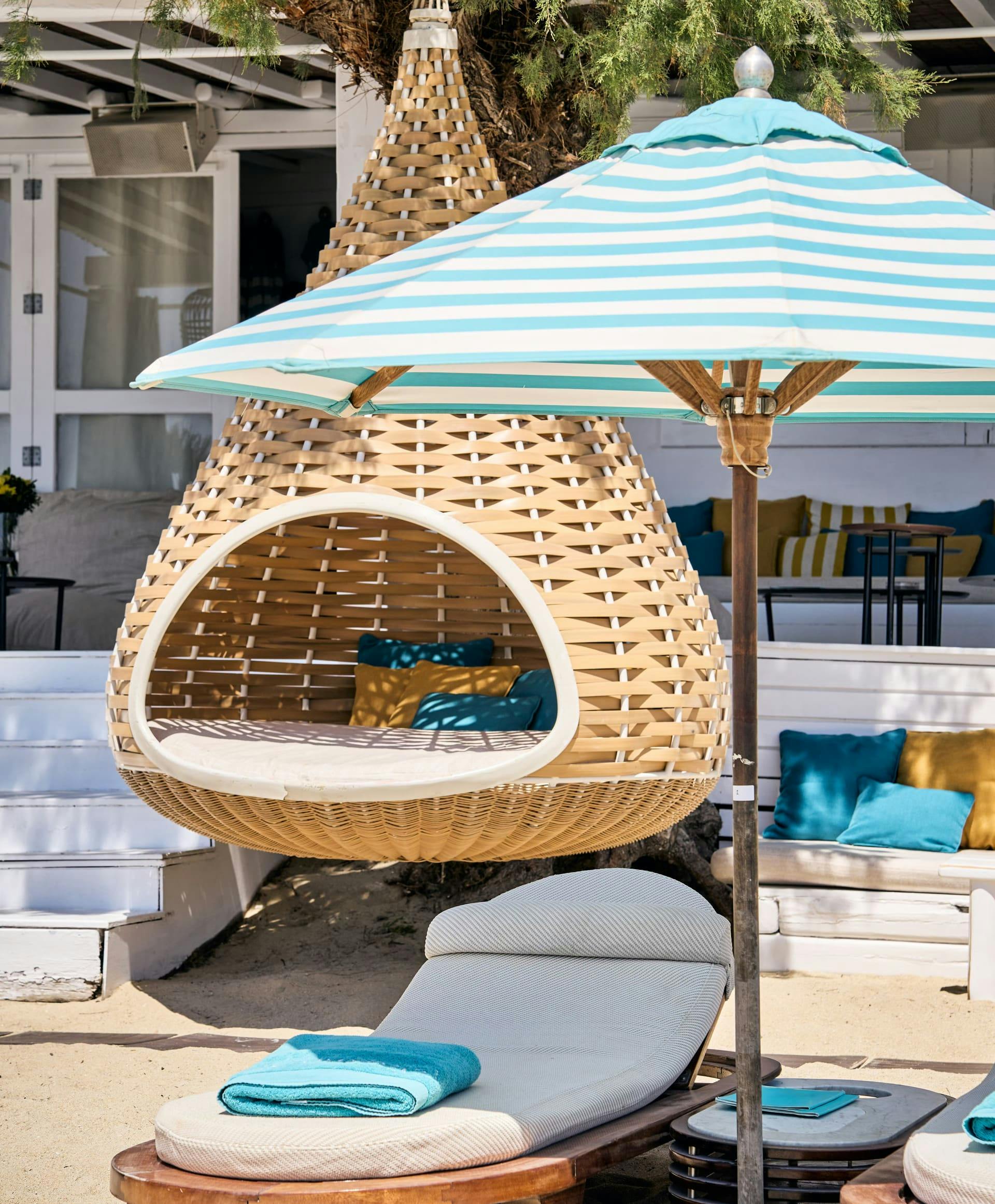 Sunbeds with parasols at Nammos Beach