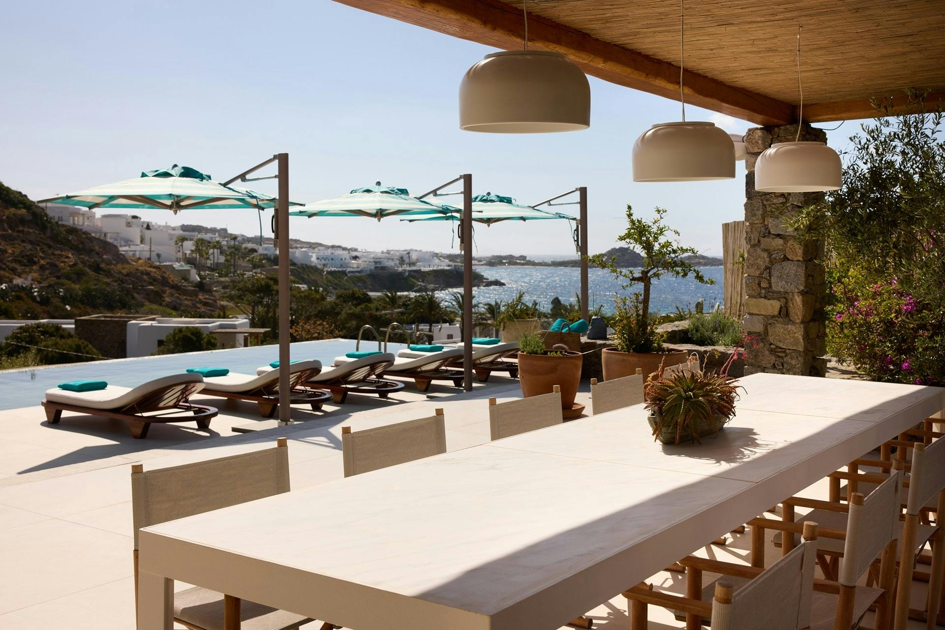 Outdoor private dining area next to private pool at Nammos Villas