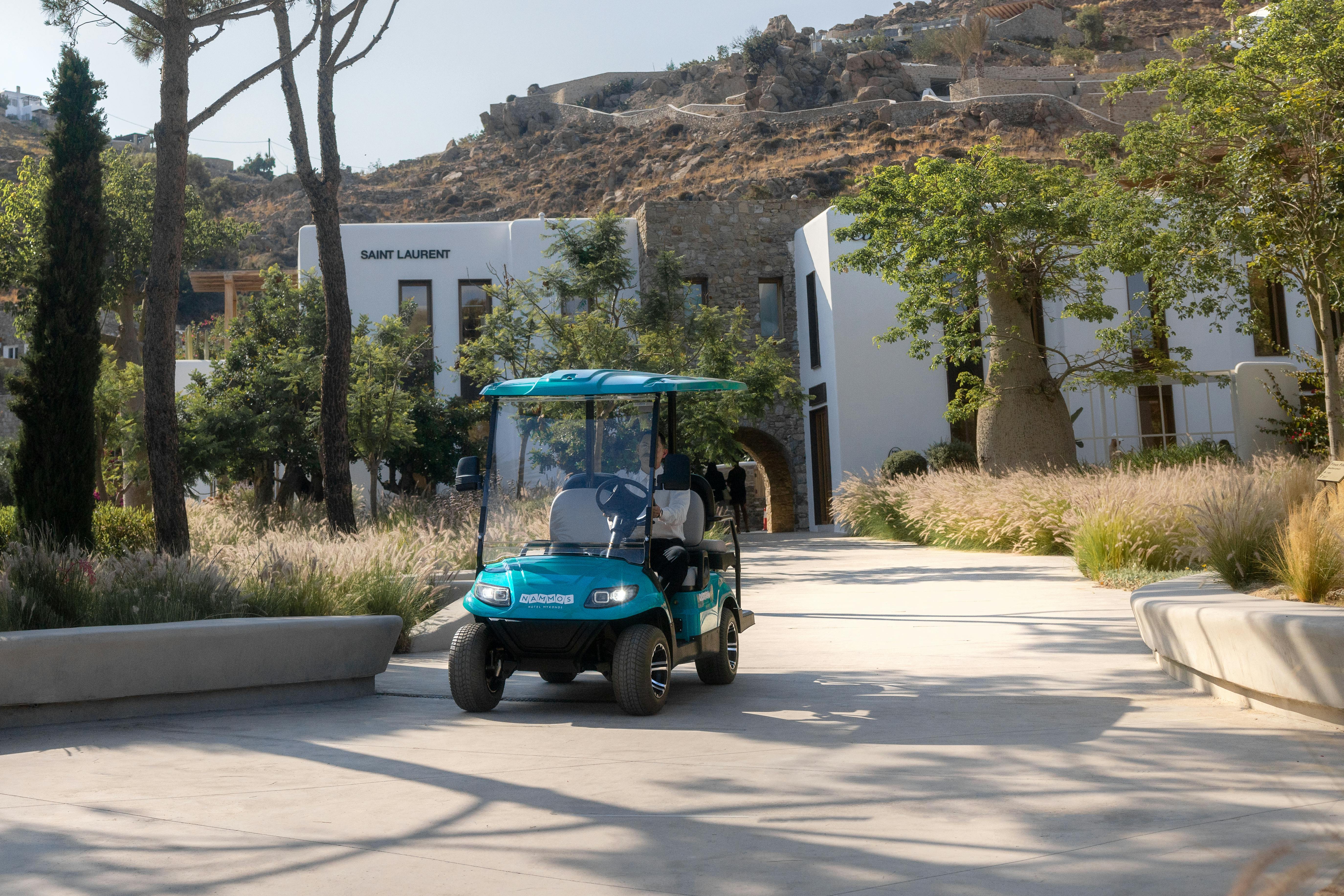 Buggy driving through Nammos Village