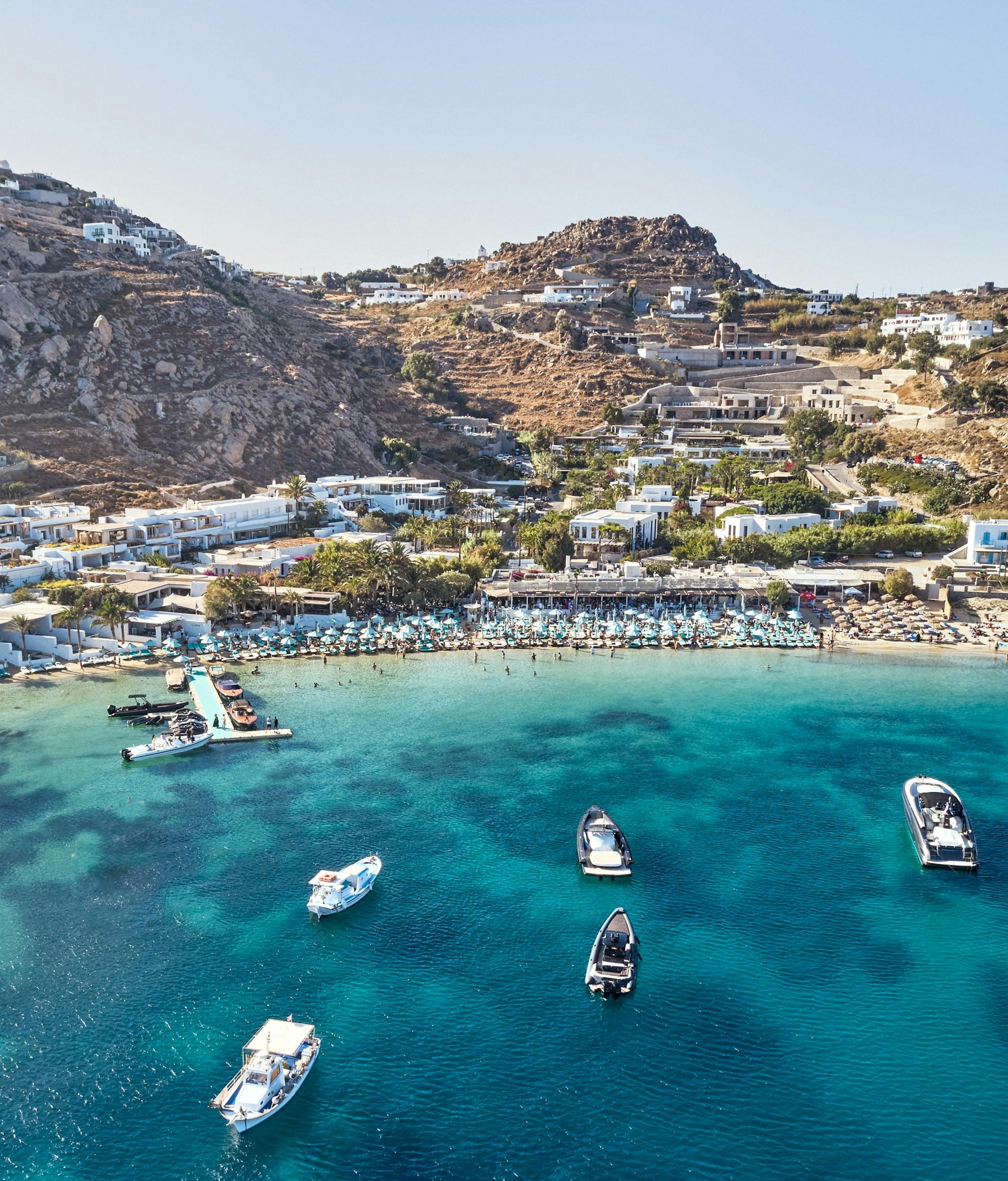 Birds eye view of Psarou Beach and blue waters of the Aegean Sea