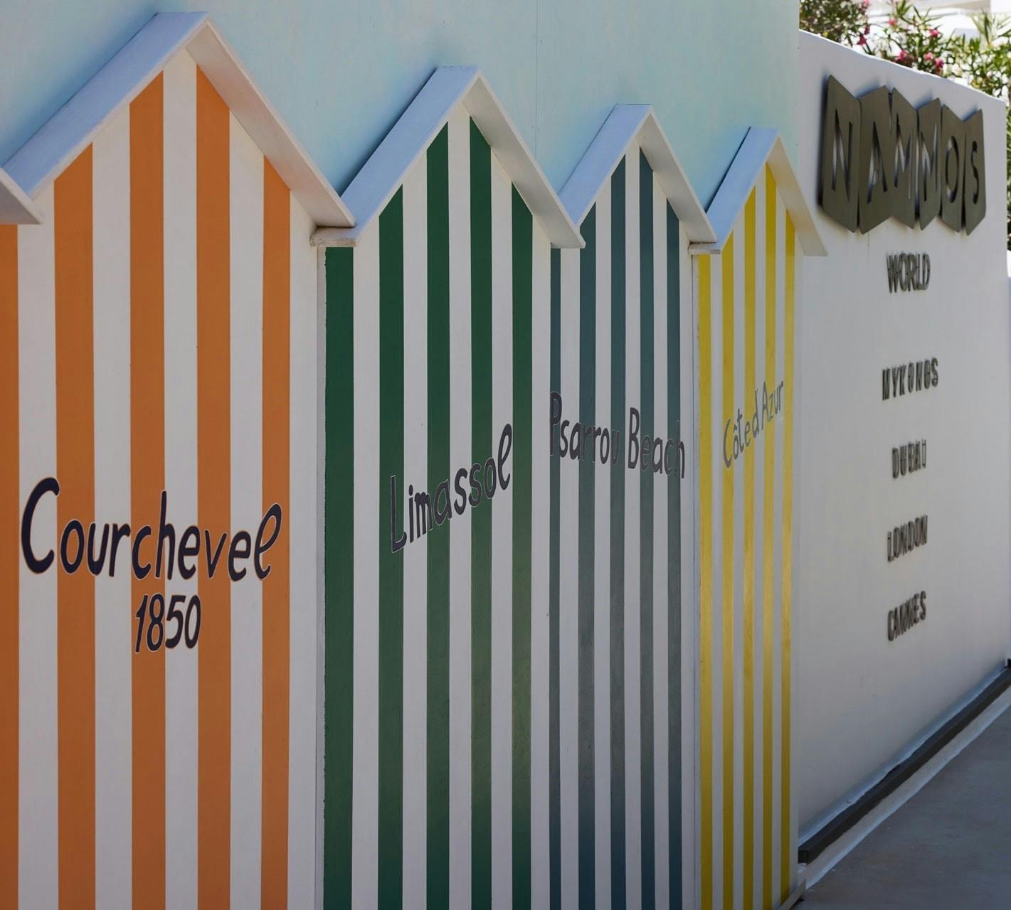 Colourful striped huts at Nammos