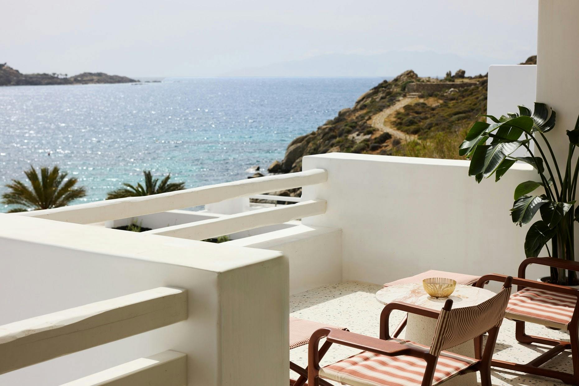 Chairs on terrace overlooking the Aegean Sea