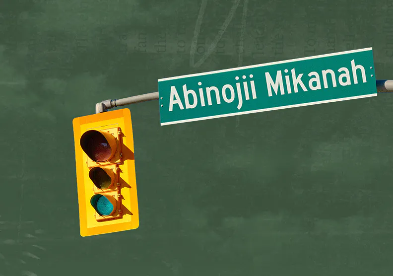 Abinojii Mikanah street signage with a traffic light.