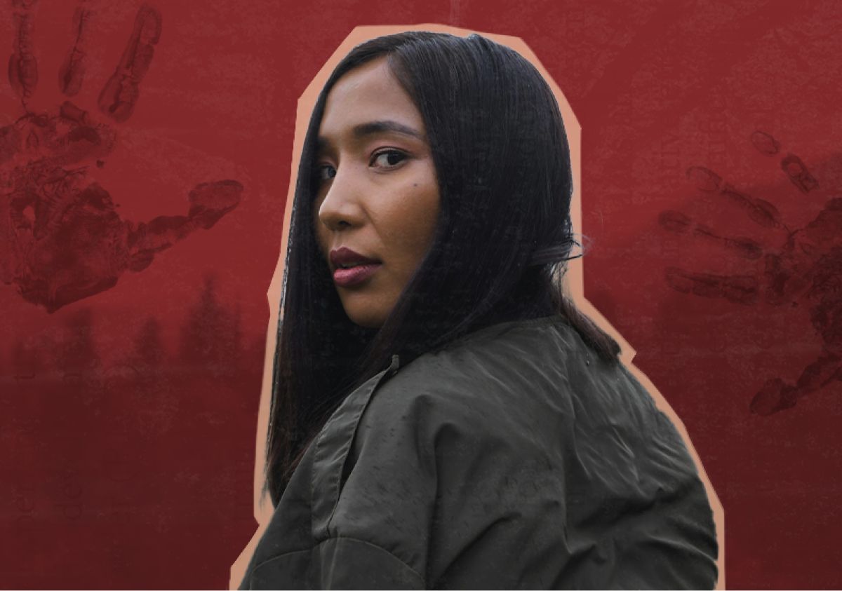 An Indigenous woman looking back over her shoulder