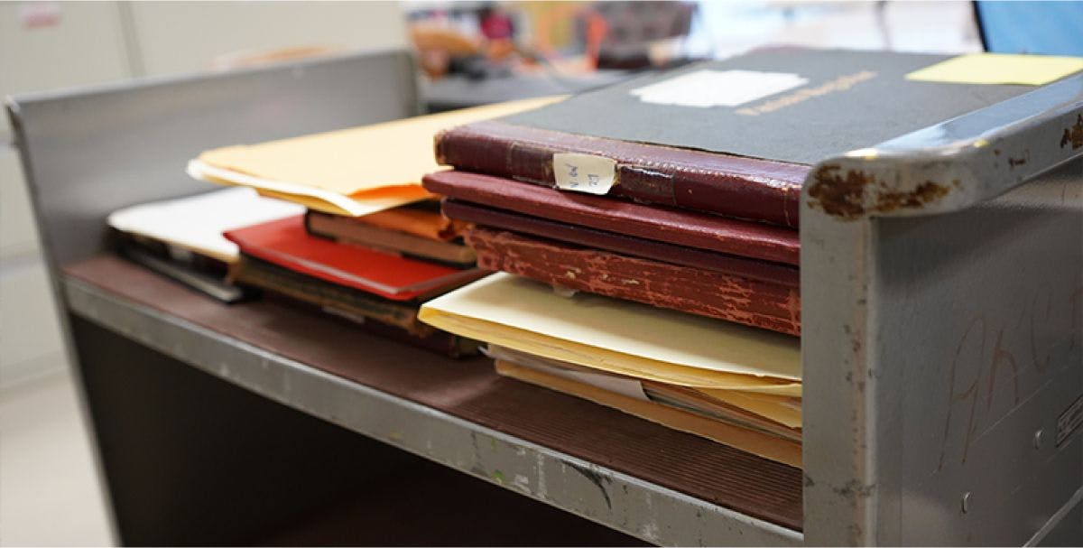 A cart of old documents and books