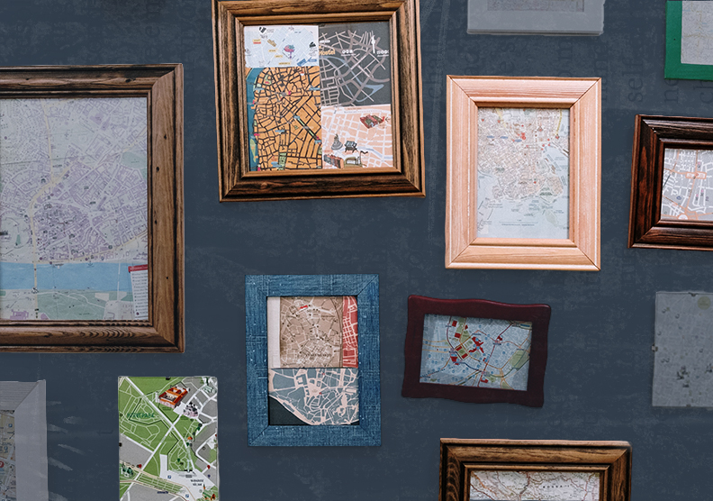 A wall of frames in different styles that show different types of maps