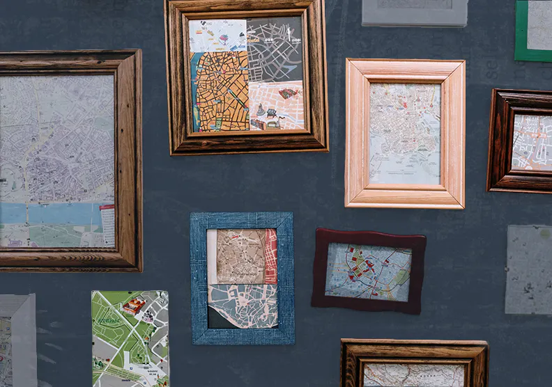 A wall of frames in different styles that show different types of maps