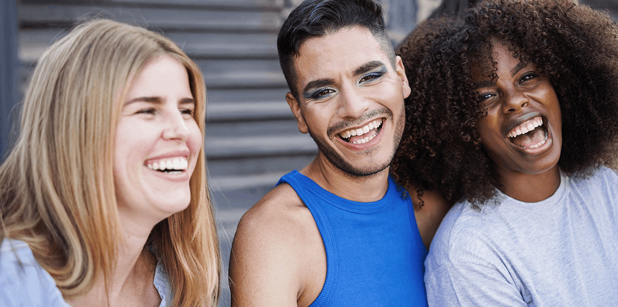 Three women laughing.