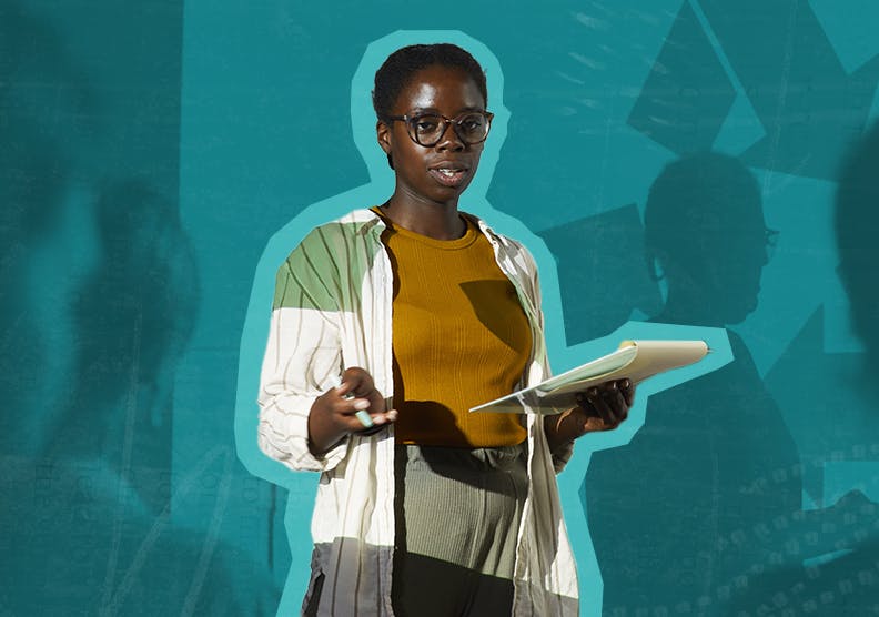 Woman standing in front of a whiteboard giving a presentation