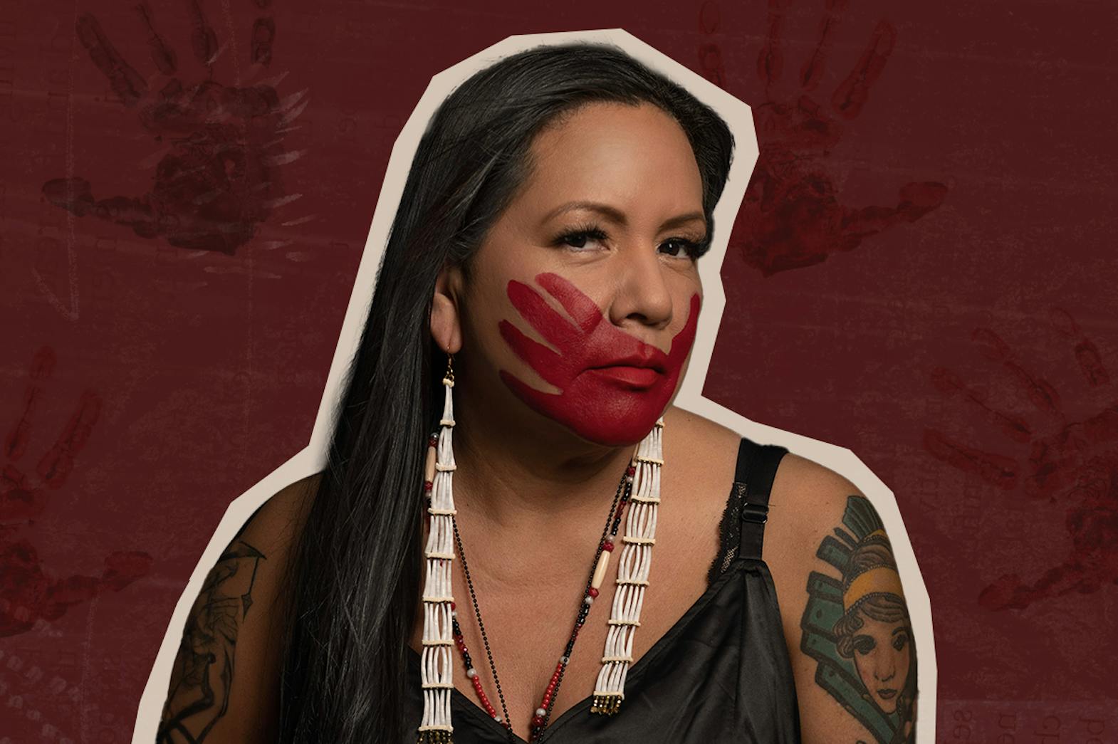 An Indigenous woman with a red handprint covering her mouth