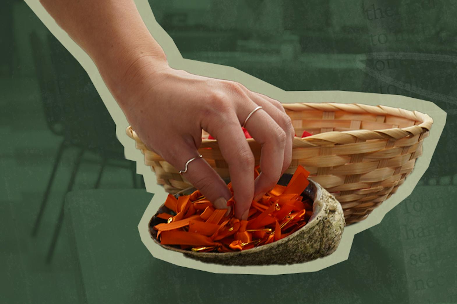 A hand reaches into a turtle shell full of orange ribbons